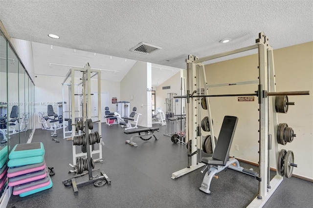 2215 Cypress Island Dr Unit 707, Pompano Beach, FL 33069 - exercise room with a textured ceiling