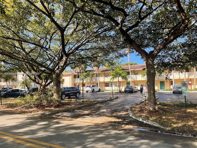 3276 NW 102nd Ter Unit 201-E, Coral Springs, FL 33065 - view of front facade with uncovered parking and a residential view