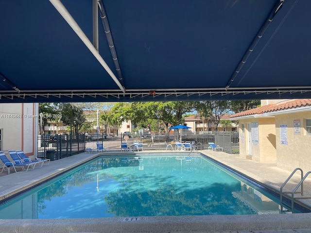 3276 NW 102nd Ter Unit 201-E, Coral Springs, FL 33065 - community pool with a patio