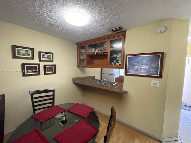 3276 NW 102nd Ter Unit 201-E, Coral Springs, FL 33065 - dining room featuring a textured ceiling