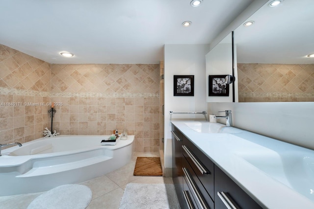 4000 Towerside Ter Unit 1005, Miami, FL 33138 - bathroom featuring tile patterned flooring, a garden tub, recessed lighting, tile walls, and vanity