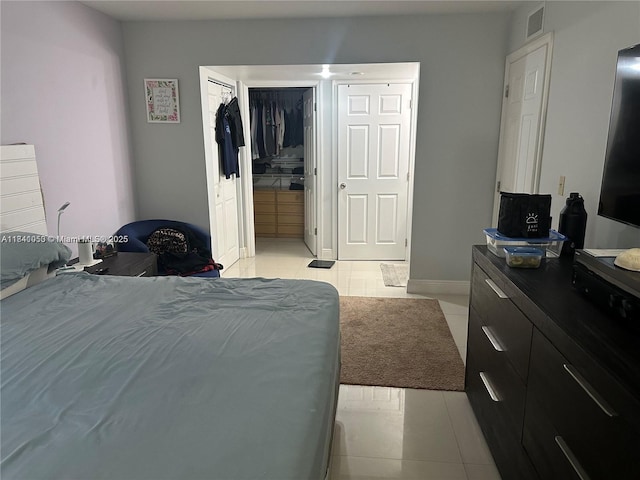 13810 SW 112th St Unit 106, Miami, FL 33186 - bedroom featuring light tile patterned floors and a closet