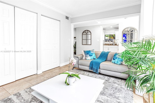 16041 Fairway Ter Unit 121, Weston, FL 33326 - living area featuring ornamental molding and light tile patterned flooring