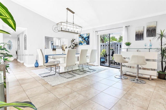 16041 Fairway Ter Unit 121, Weston, FL 33326 - dining area with crown molding, a chandelier, tile patterned flooring, and lofted ceiling