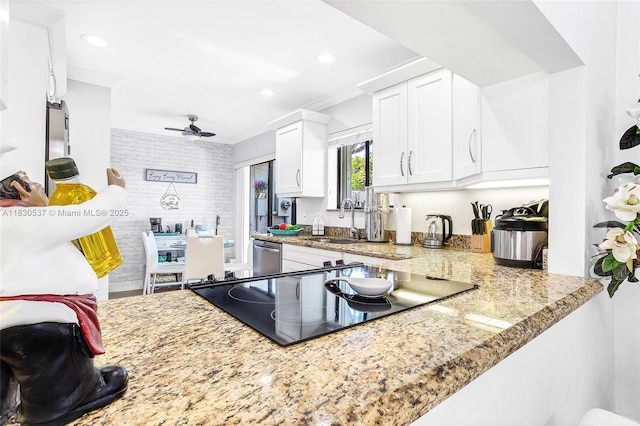 16041 Fairway Ter Unit 121, Weston, FL 33326 - kitchen with white cabinets, ceiling fan, ornamental molding, light stone counters, and recessed lighting