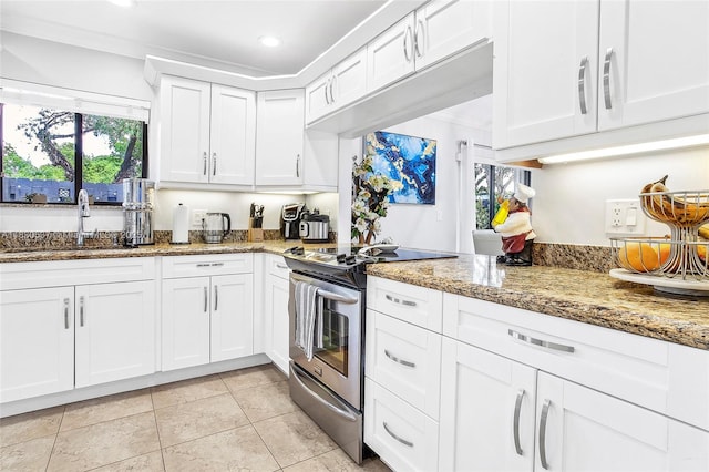 16041 Fairway Ter Unit 121, Weston, FL 33326 - kitchen featuring stainless steel range with electric cooktop, white cabinetry, light stone counters, recessed lighting, and light tile patterned flooring