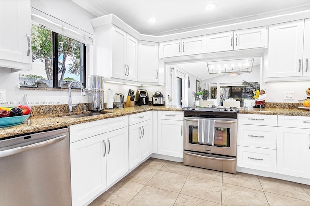 16041 Fairway Ter Unit 121, Weston, FL 33326 - kitchen featuring stainless steel appliances, white cabinets, crown molding, light tile patterned floors, and recessed lighting