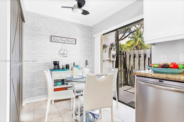 16041 Fairway Ter Unit 121, Weston, FL 33326 - dining room with ceiling fan, light tile patterned floors, and brick wall