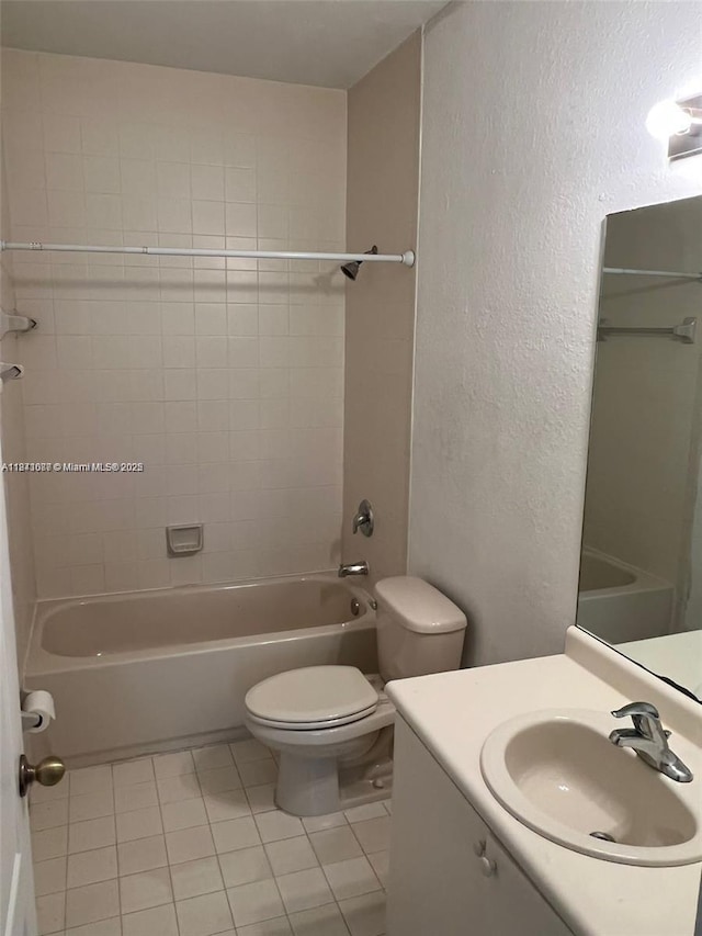 1666 SE 27th Ct Unit 208, Homestead, FL 33035 - bathroom with tile patterned flooring, vanity, washtub / shower combination, and a textured wall