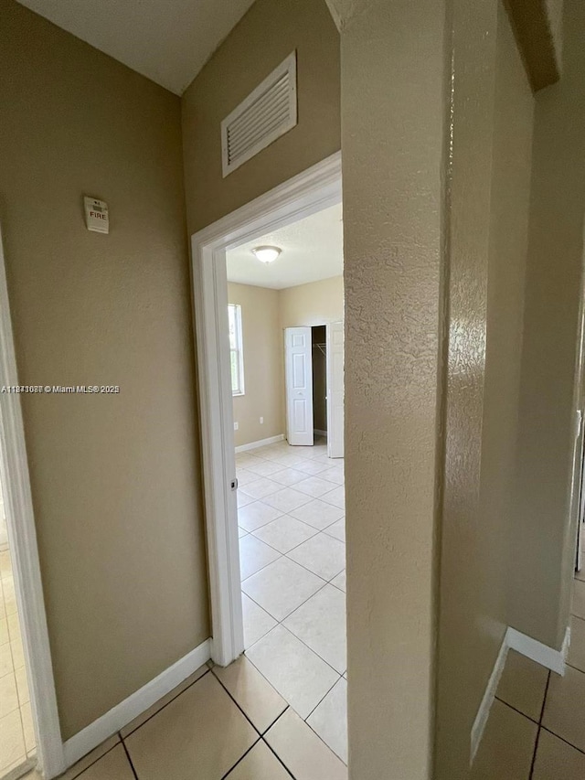 1666 SE 27th Ct Unit 208, Homestead, FL 33035 - hall with light tile patterned floors and baseboards
