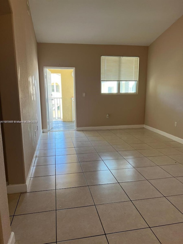1666 SE 27th Ct Unit 208, Homestead, FL 33035 - empty room with plenty of natural light and light tile patterned floors