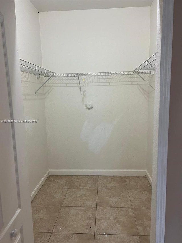 1666 SE 27th Ct Unit 208, Homestead, FL 33035 - walk in closet featuring light tile patterned flooring