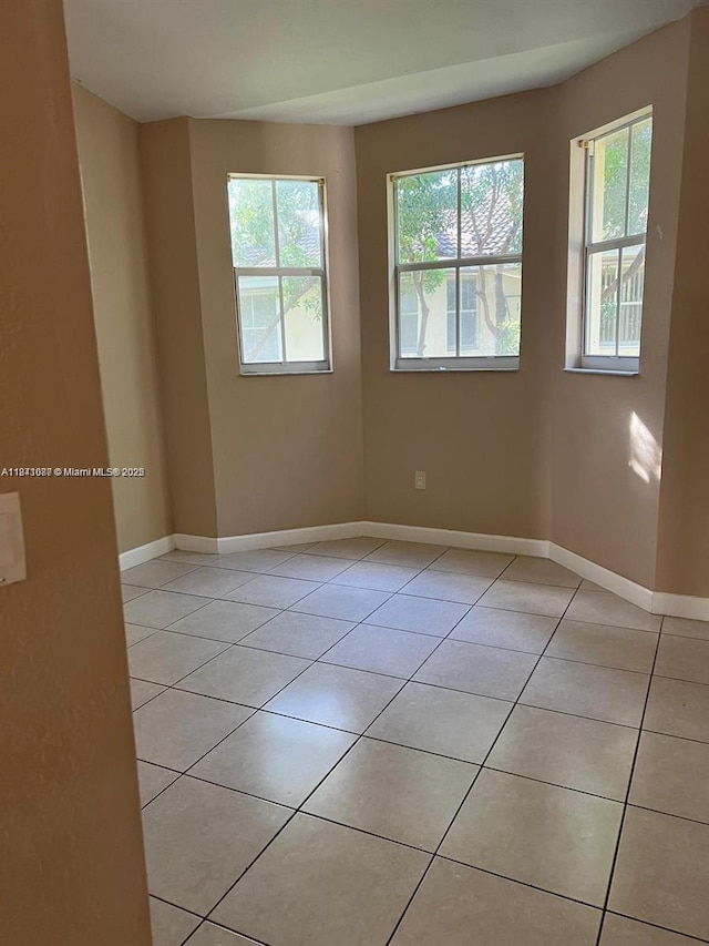 1666 SE 27th Ct Unit 208, Homestead, FL 33035 - unfurnished room with light tile patterned flooring and baseboards