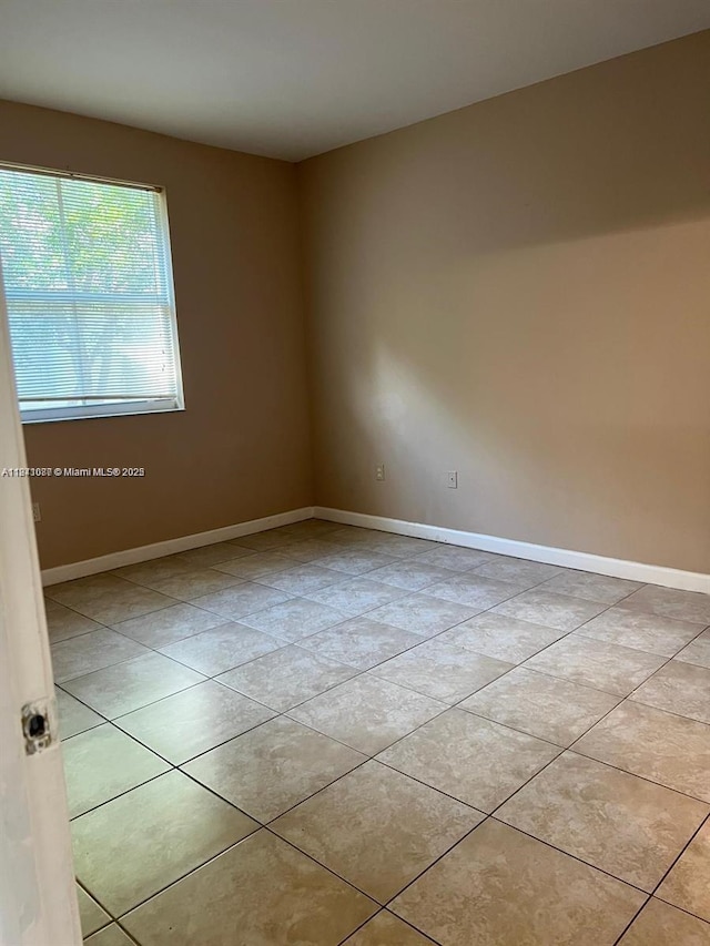 1666 SE 27th Ct Unit 208, Homestead, FL 33035 - spare room with light tile patterned flooring