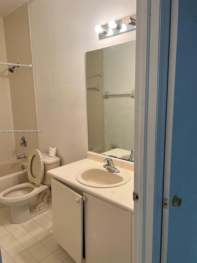 1666 SE 27th Ct Unit 208, Homestead, FL 33035 - full bath with a textured wall, tile patterned floors, vanity, and shower / tub combination