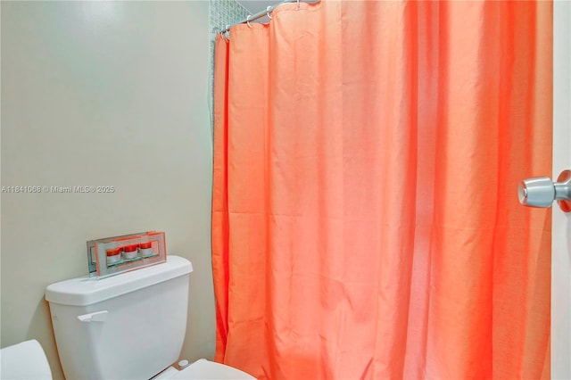3651 Environ Blvd Unit 461, Lauderhill, FL 33319 - bathroom featuring toilet and curtained shower