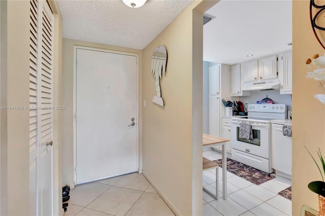 3651 Environ Blvd Unit 461, Lauderhill, FL 33319 - entryway featuring light tile patterned floors and a textured ceiling