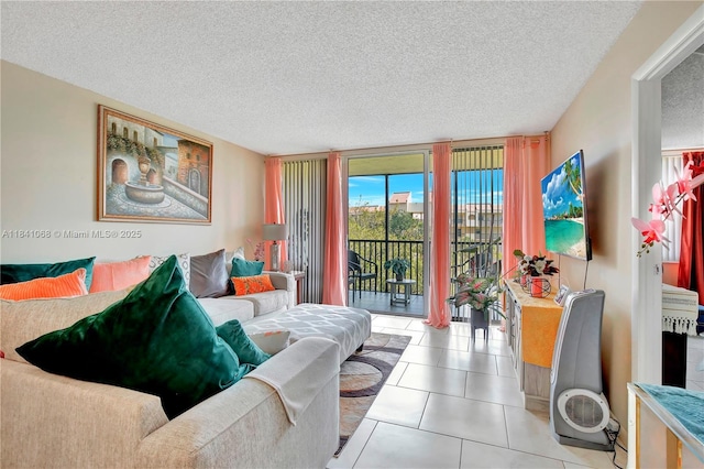 3651 Environ Blvd Unit 461, Lauderhill, FL 33319 - living room featuring a textured ceiling, tile patterned flooring, and a wall of windows