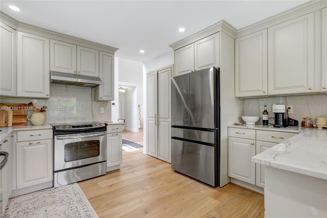 1503 NW 178th Ln, Pembroke Pines, FL 33029 - kitchen with stainless steel appliances, recessed lighting, light wood-style flooring, backsplash, and under cabinet range hood