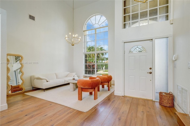 1503 NW 178th Ln, Pembroke Pines, FL 33029 - foyer featuring a high ceiling, a chandelier, and hardwood / wood-style floors