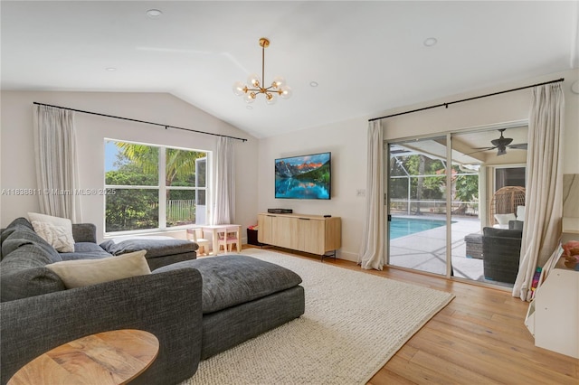 1503 NW 178th Ln, Pembroke Pines, FL 33029 - living room featuring plenty of natural light, vaulted ceiling, light wood-style floors, and a chandelier