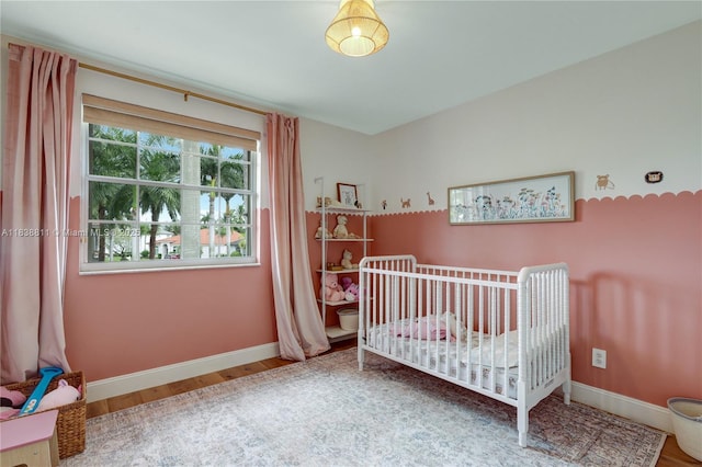 1503 NW 178th Ln, Pembroke Pines, FL 33029 - bedroom with wood finished floors and a nursery area