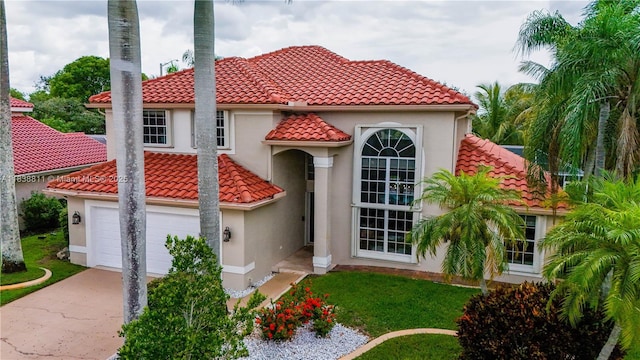 1503 NW 178th Ln, Pembroke Pines, FL 33029 - mediterranean / spanish-style house with a tile roof, driveway, stucco siding, an attached garage, and a front yard