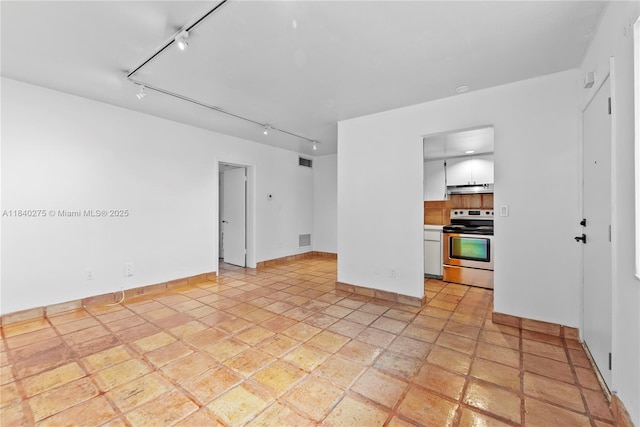 2924 Day Ave Unit N211, Miami, FL 33133 - spare room featuring track lighting and baseboards