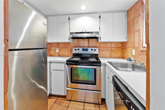 2924 Day Ave Unit N211, Miami, FL 33133 - kitchen with stainless steel appliances, light countertops, under cabinet range hood, white cabinetry, and recessed lighting