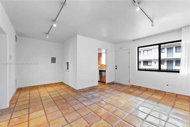 2924 Day Ave Unit N211, Miami, FL 33133 - spare room featuring track lighting, light tile patterned floors, and electric panel