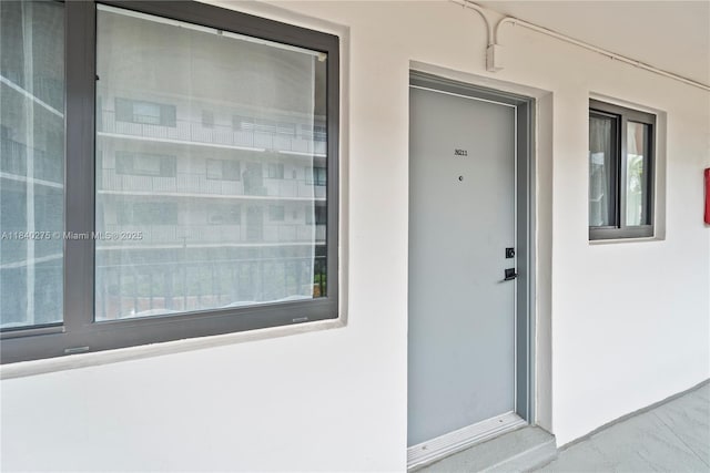 2924 Day Ave Unit N211, Miami, FL 33133 - doorway to property featuring stucco siding