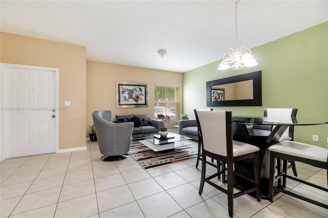 14053 SW 49th St Unit 7, Miramar, FL 33027 - dining area with a chandelier and light tile patterned floors