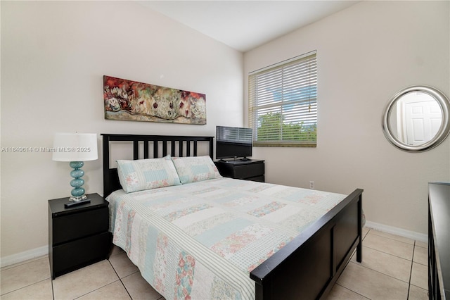 14053 SW 49th St Unit 7, Miramar, FL 33027 - bedroom featuring baseboards and light tile patterned flooring