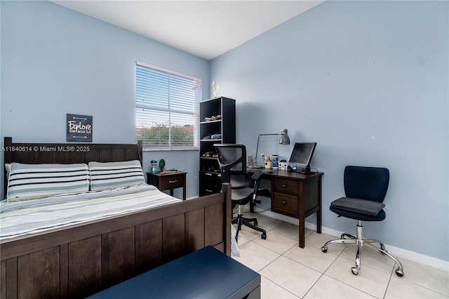14053 SW 49th St Unit 7, Miramar, FL 33027 - bedroom featuring light tile patterned floors and a desk