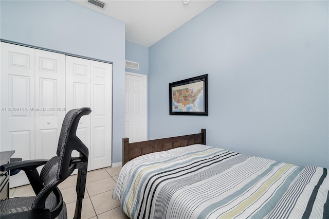 14053 SW 49th St Unit 7, Miramar, FL 33027 - bedroom with light tile patterned floors, a closet, vaulted ceiling, and an office area