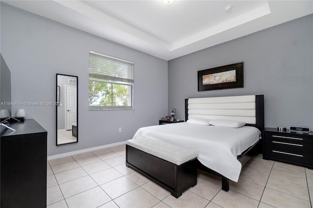 14053 SW 49th St Unit 7, Miramar, FL 33027 - bedroom featuring light tile patterned floors and a raised ceiling