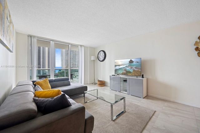 19370 Collins Ave Unit 1425, Sunny Isles Beach, FL 33160 - living room featuring a textured ceiling, expansive windows, and marble look tile flooring