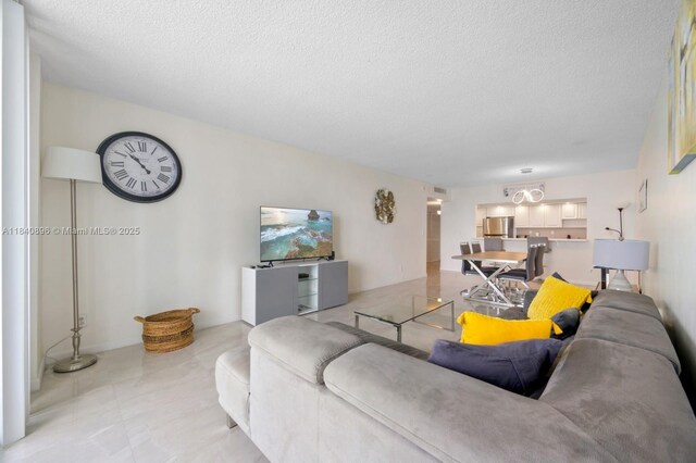 19370 Collins Ave Unit 1425, Sunny Isles Beach, FL 33160 - living area featuring a textured ceiling