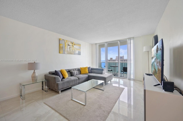 19370 Collins Ave Unit 1425, Sunny Isles Beach, FL 33160 - living room featuring expansive windows, a textured ceiling, and marble tiled flooring