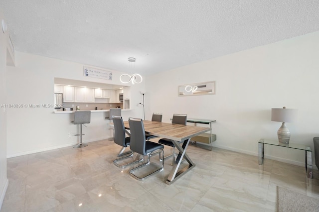 19370 Collins Ave Unit 1425, Sunny Isles Beach, FL 33160 - dining room featuring light marble finish flooring and a textured ceiling