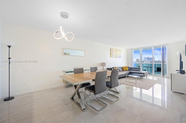 19370 Collins Ave Unit 1425, Sunny Isles Beach, FL 33160 - dining room featuring a wall of windows and a chandelier