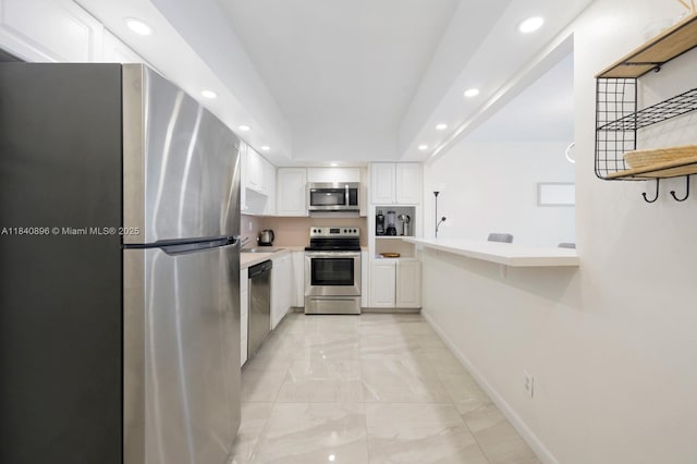 19370 Collins Ave Unit 1425, Sunny Isles Beach, FL 33160 - kitchen featuring recessed lighting, stainless steel appliances, white cabinets, light countertops, and light marble finish floors