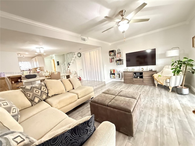 11 Olive Dr Unit E, Hialeah, FL 33010 - living area with stairs, a ceiling fan, wood finished floors, and crown molding