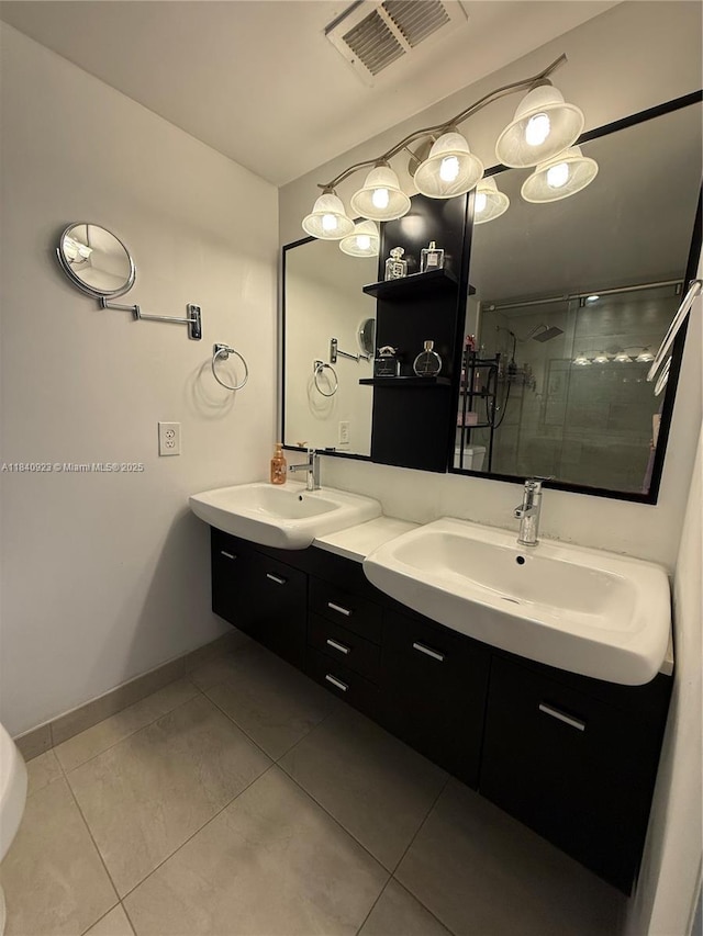 11 Olive Dr Unit E, Hialeah, FL 33010 - full bathroom featuring double vanity, a stall shower, and tile patterned flooring