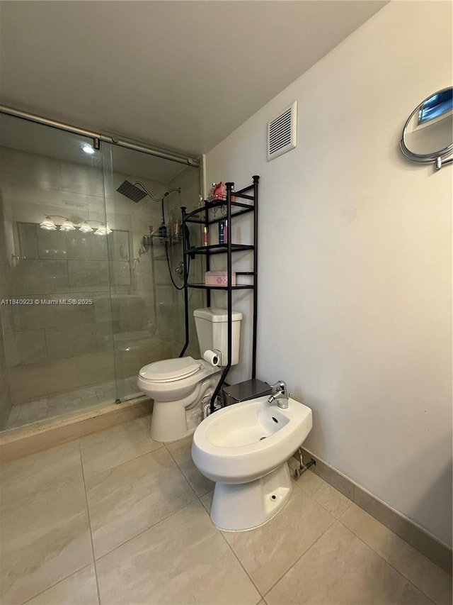 11 Olive Dr Unit E, Hialeah, FL 33010 - full bathroom featuring tile patterned floors, a stall shower, and a bidet