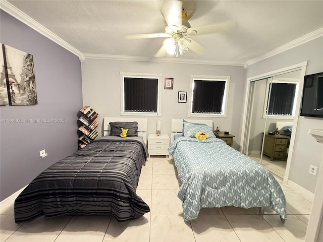 11 Olive Dr Unit E, Hialeah, FL 33010 - bedroom with crown molding, a closet, ceiling fan, and light tile patterned flooring