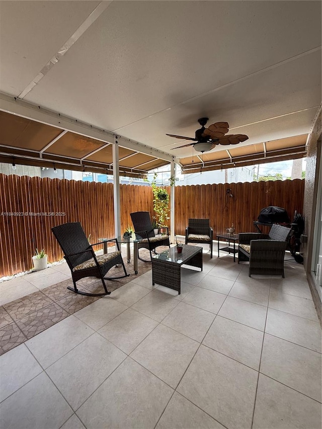 11 Olive Dr Unit E, Hialeah, FL 33010 - fenced backyard with an outdoor hangout area, a patio, and ceiling fan