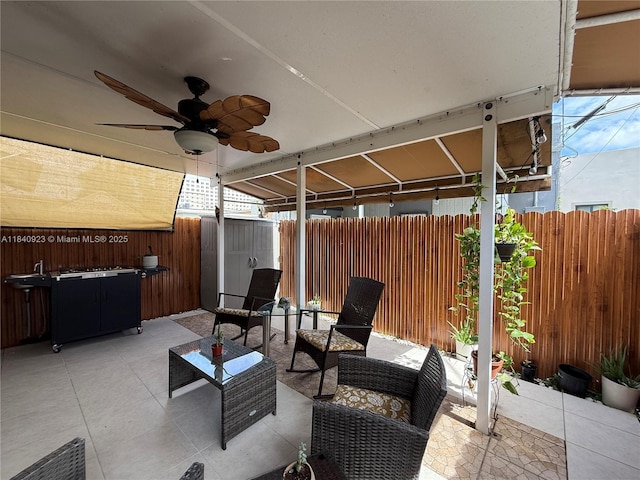 11 Olive Dr Unit E, Hialeah, FL 33010 - fenced backyard with a patio area, an outdoor living space, and a ceiling fan