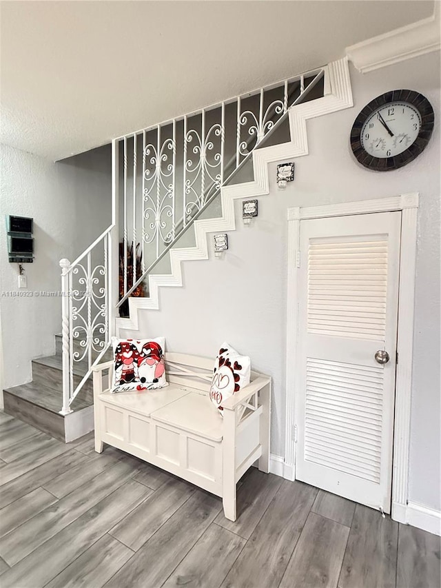 11 Olive Dr Unit E, Hialeah, FL 33010 - stairway featuring wood finished floors