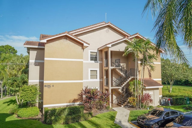 9033 Wiles Rd Unit 304, Coral Springs, FL 33067 - view of building exterior with stairs